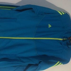 Blue Adidas sweater.